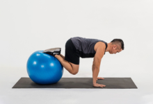 take-your-planks-to-the-next-level-with-the-stability-ball-knee-tuck