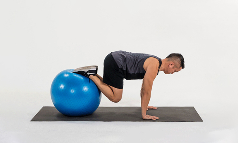 take-your-planks-to-the-next-level-with-the-stability-ball-knee-tuck